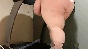Obese woman exercises on treadmill and smoothes out her large bust and hips
