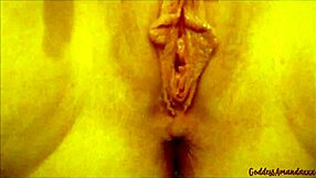 she plays with her shaved clit leading to pissing orgasms