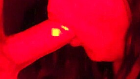 Busty asian gives blowjob under rgb lights