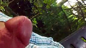 watch this mature guy spray outdoors?