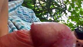 watch this mature guy spray outdoors?