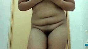 asian lady dances solo in a graceful performance