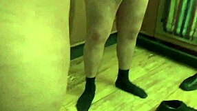 This little slut undresses while cooking in the kitchen, teasing her big tits