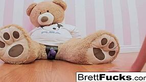 Busty Brett Rossi teases with a stuffed bear's strap-on dildo. What’s next?
