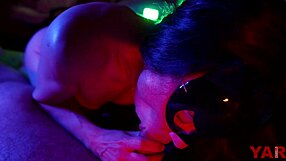 masked woman sucks big cock gently in neon light to music