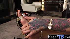 Megan Snow, a gorgeous ebony transsexual, indulges in her foot fetish.