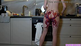 naked housewife with octopus tattoo on ass cooks in kitchen, but does she notice you watching?