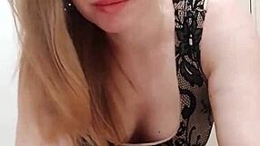 Milf sucks dildo while caressing wet pussy in restroom