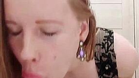 Milf sucks dildo while caressing wet pussy in restroom