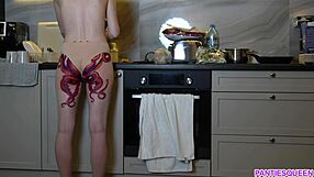 naked housewife with octopus tattoo on ass cooks in kitchen, but does she notice you watching?