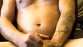 A Sexy Tattooed Man Receives Blowjob from Petite Amateur