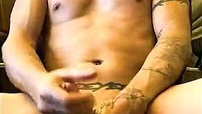 A Sexy Tattooed Man Receives Blowjob from Petite Amateur