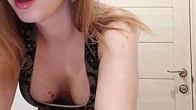 Milf sucks dildo while caressing wet pussy in restroom