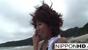 Asian hottie relaxes at the beach