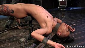 Slim ebony slave endures whipping and deepthroat in kinky device bondage with small tits exposed