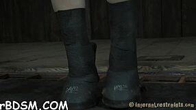 Gagged woman endures rough cunt play from Hangman