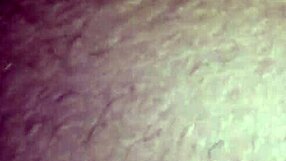 Ann's lips wrapped around a massive black cock in intense sucking. The contrast is thrilling.