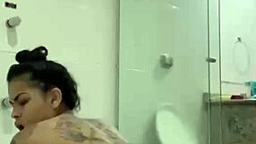 Hot brunette bia masturbates with shower jet