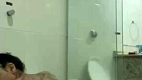 Hot brunette bia masturbates with shower jet