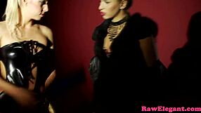 Two tattooed girls with latex clothing experience each other’s bodyافع