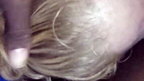 Ann's lips wrapped around a massive black cock in intense sucking. The contrast is thrilling.