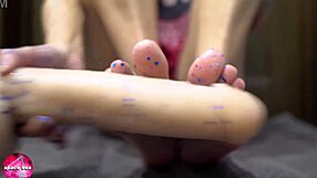 Babe Performs Sensual Footjob On Rubber Cock In Fetish Scene