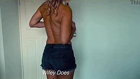 wife casually strips out of her tight denim shorts