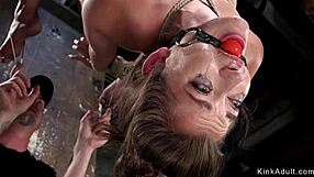 Gagged submissive bound in upside down hogtie suspension for kinky fucking.