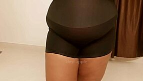 Sexually attractive Hispanic female, wearing a blouse that exposes her chest