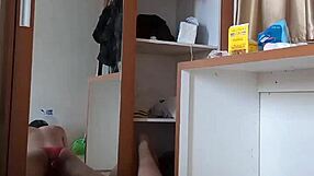 Sexy gay in red lingerie and mask enjoys anal play