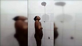 Huge Titted Black Cutie Showers Sensually.