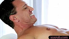 cute masseuse sneaks a blowjob on client's hard dick under the table