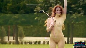 Big-ass milf redhead Heidi Romanova strips naked while playing golf on the green