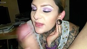 i admire the tattooed beauty's oral skills in this intimate moment