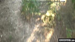 Beast licks bound woman outdoors.