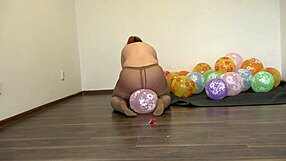 A bbw in pantyhose pops balloons with her big ass