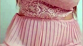 A pink dressed freshman showing off her belongings and having fun alone