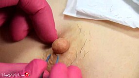 i can't believe this beautician is plucking my nipples in red latex gloves