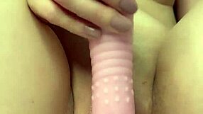 petite amateur masturbates shaved pussy in close-up