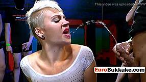 the short-haired beauty faces a group of huge cocks in an intense blowbang session