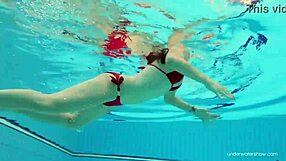 Hey, check out Katy Soroka in red swimwear by the pool