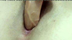 Sexy hot milf fingers herself with dildo