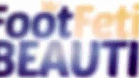 tattooed redhead gives herself an oil foot massage