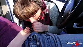She gives a sloppy blowjob and swallows cum in the car during a public outing