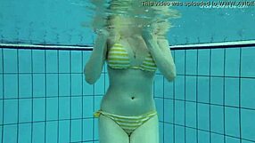 Teen Lada with small tits strips naked underwater now!