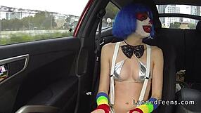 Young clown gives a hardcore blowjob to a hitchhiking motorist in a bikini.