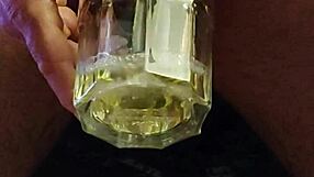 Drunk guy pissing and sipping it in a twisted game.