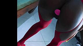 Alluring ebony slut teases with monster buttplug in tight pussy