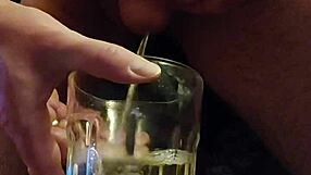 Drunk guy pissing and sipping it in a twisted game.