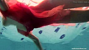 Firm big tits shine in red dress underwater
